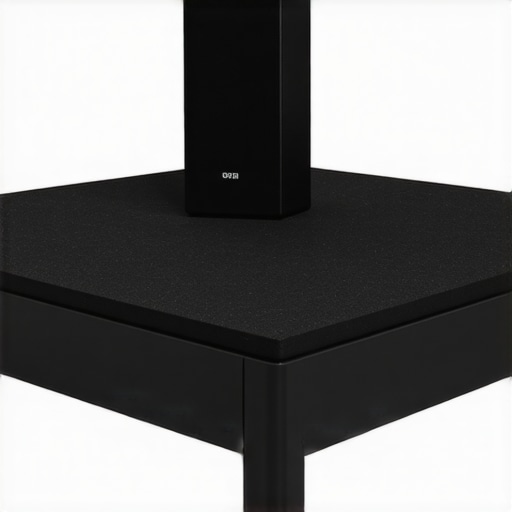 Close-up of a bookshelf speaker corner resting on an isolation pad to prevent vibration