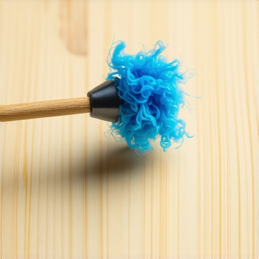 A wooden toothpick removing lint from a 3.5mm audio port